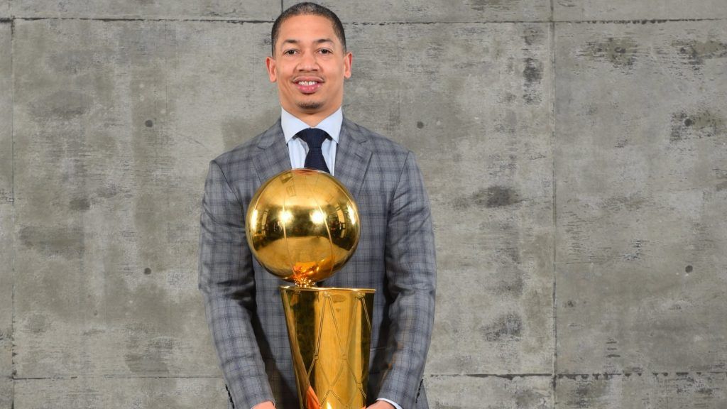 Ty Lue holds NBA trophy